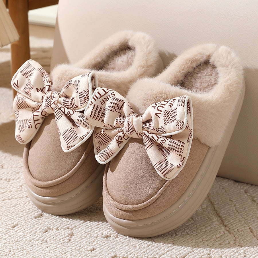 Cozy winter slippers with bow, providing warmth and elegant style for the home.