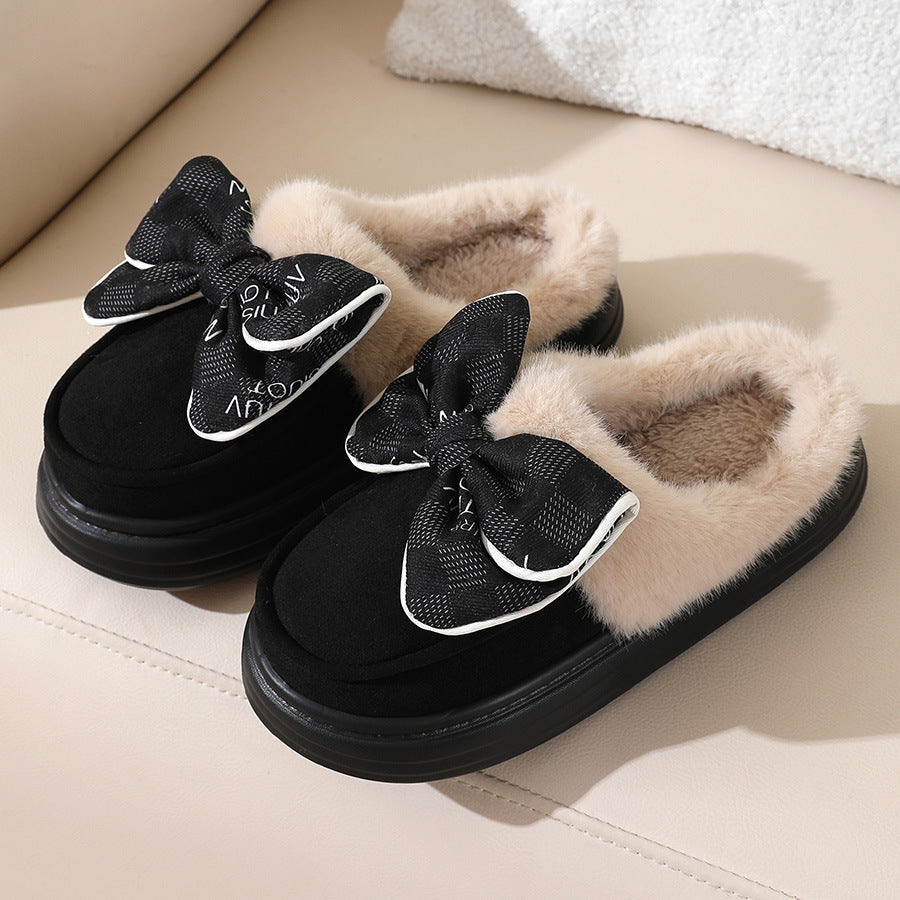 Fluffy black winter slippers with bow for warmth and style